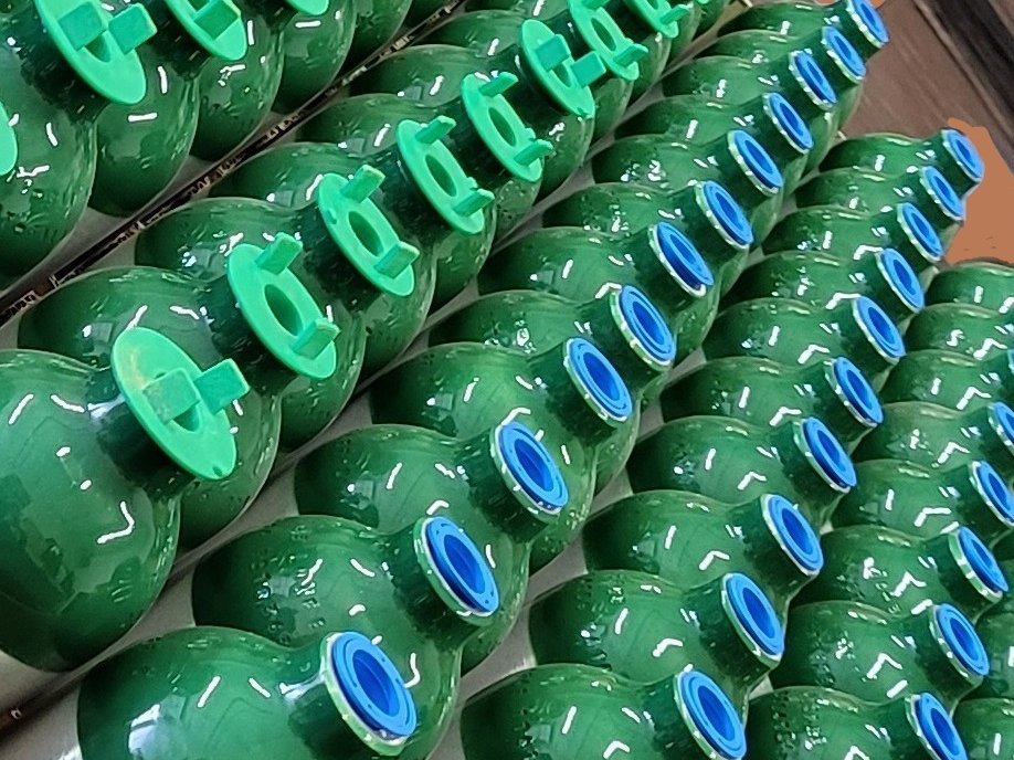 Cylinder valves and collars awaiting inspection